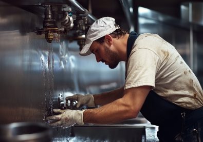 highresolution-image-plumber-fixing-broken-pipe-commercial-kitchen4