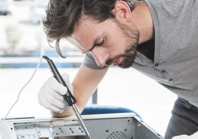 side-view-male-technician-repairing-computer-cpu-workshop